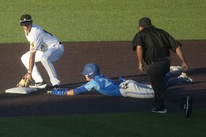 Iowa infielder Dylan Nedved attempts to tag out an Ontario player sliding into second base during the seventh inning of a game against Ontario at Duane Banks Field on Friday, September 13, 2019. Ontario was called safe. The Hawkeyes defeated the Blue Jays  30-6 in 14 innings.