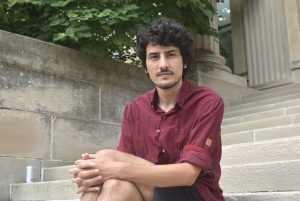 UI graduate student Ramin Roshandel poses for a portrait outside on Sunday Aug. 2 2020 outside Shaffer Hall. Roshandel is currently working on his Ph.D. in music composition.