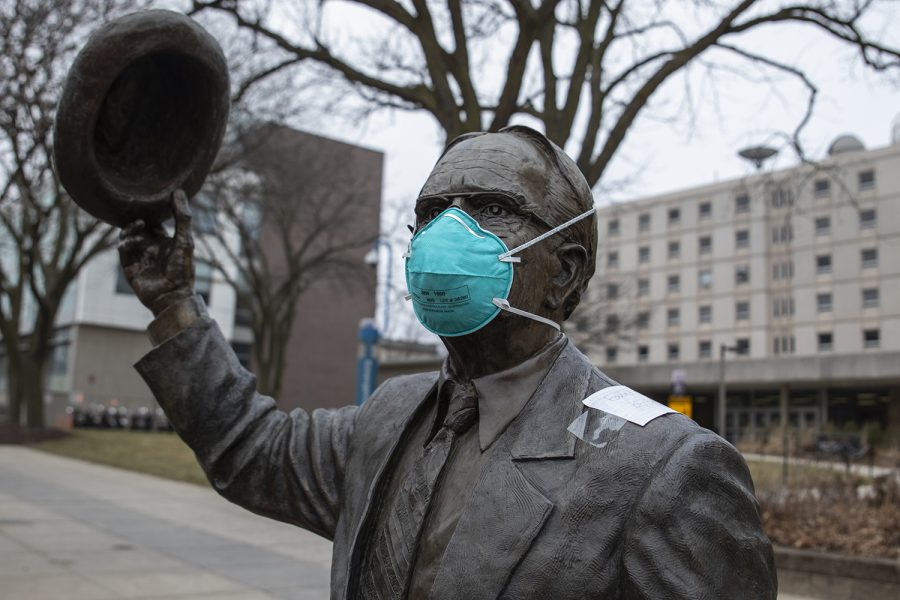 A mask sits on the Irving B. Weber statue in front of Van Allen on Thursday, March 12, 2020.   The US has seen a shortage of N95 surgical masks in the recent weeks due to coronavirus. The CDC currently recommends the use of facemarks be reserved for those who are sick or for those who are caring for the sick. 