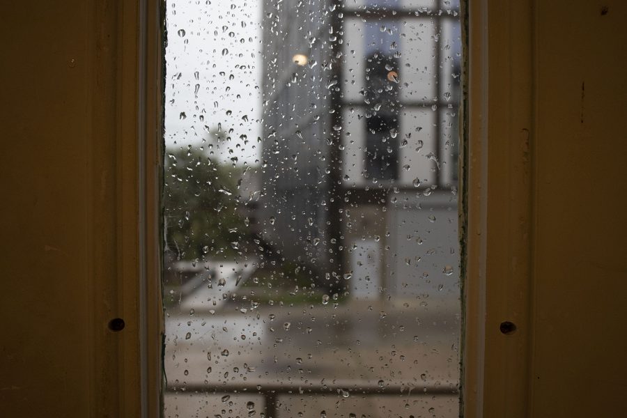 Rain is seen through a window on Monday, Aug. 10, 2020. With wind gusts around 80 mph, the derecho ­--a widespread wind damage event produced by severe thunderstorms-- hit Iowa City in the afternoon causing tree damage and power outages. 