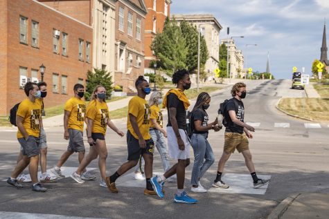 OnIowa members lead a tour of campus for first-year students on Aug. 22, 2020. 