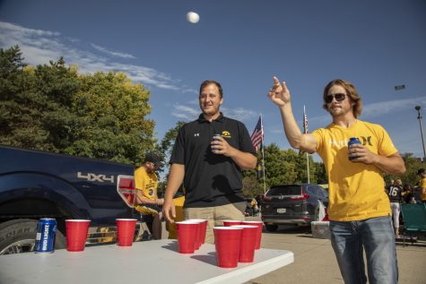 Blake Ossian of Washington, Iowa throws a ping pong in a game of beer pong during the tailgate before the Iowa vs. Rutgers game on September 7, 2019. 
