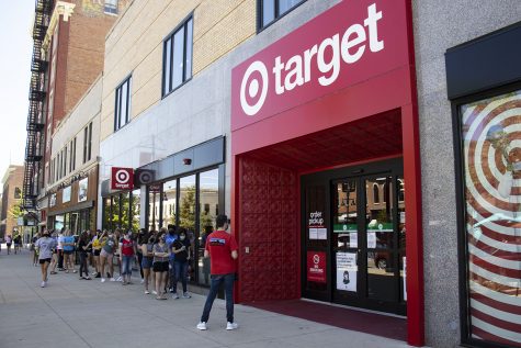 Customers wait outside the storefront of Target during the grand opening on Sunday, Aug. 16, 2020 in downtown Iowa City. The store had a soft opening four days earlier on Wednesday.