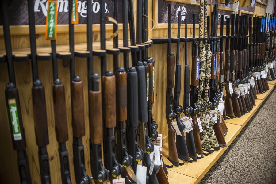 Guns are displayed at Scheels in Coralville on Tuesday, April 11. The Iowa House recently accepted the stand-your-ground-provision, an amendment to HF 517, which permits an individual to use deadly force when their life is in danger.
