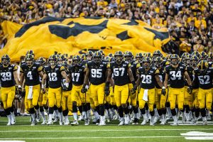 Iowa players walk onto the field for the first game of their season  against Miami (Ohio) at Kinnick Stadium on Saturday, August 31, 2019. The Hawkeyes defeated the Redhawks 38-14. 