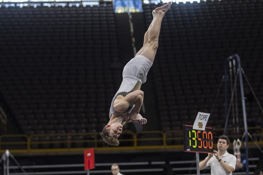 Iowa’s Stewart Brown performs his floor routine during a Men’s gymnastics meet against The University of Minnesota and the University of Illinois at Chicago. The Hawkeyes won with a final team score of 400.00. 