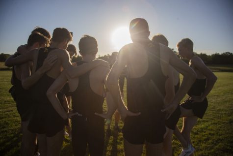 The Iowa men’s team huddle up before starting the 6k during the Hawkeye Invitational at Ashton Cross Country Course on Friday, September 6, 2019. The Hawkeyes defeated six other teams to finish first overall for both men’s and women’s races. 