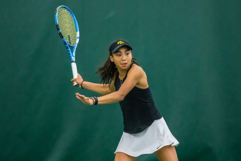 Iowas Michelle Bacalla hits a forehand during a womens tennis match between Iowa and Nebraska at the HTRC on Saturday, April 13, 2019. The Hawkeyes, celebrating senior day, fell to the Cornhuskers, 4-2. 