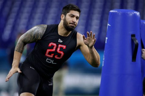 Defensive lineman A.J. Epenesa of Iowa runs a drill during the NFL Combine at Lucas Oil Stadium in Indianapolis on February 29, 2020.