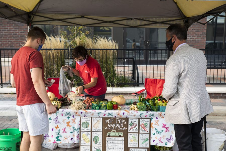 Purchasing fresh produce at the Coralville Farmers Market 201 E. 9th St..As seen on Monday, Sept 14, 2020.