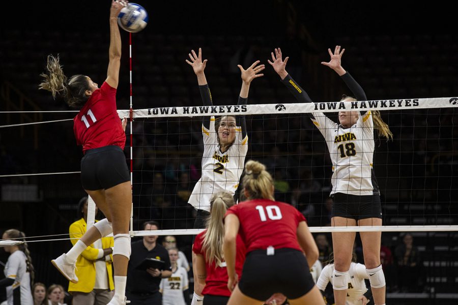 Courtney+Buzzerio+and+Hannah+Clayton+try+to+stop+the+Huskers+from+scoring+during+the+Iowa+and+Nebraska+volleyball+game.+The+Huskers+defeated+the+Hawkeyes+in+three+sets+on+November+9%2C+2019%2C+at+Carver-Hawkeye+Arena.+