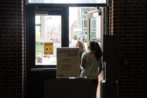 A pair of University of Iowa students leave the nearly deserted Chemistry Building on the first day of the new semester on Monday, August 24th, 2020. Despite the pandemic, campus remains open and some classes are still being held in person. 