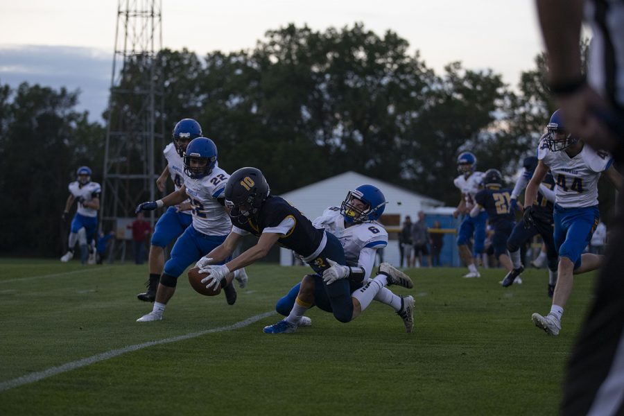 Reginas Alec Wick is tackled during a varsity football game with Wapello High School at Regina Catholic Education Center on Friday, Sept. 18, 2020 in Iowa City. The Regals defeated the Indians with a score 43-16. (Hannah Kinson/The Daily Iowan)
