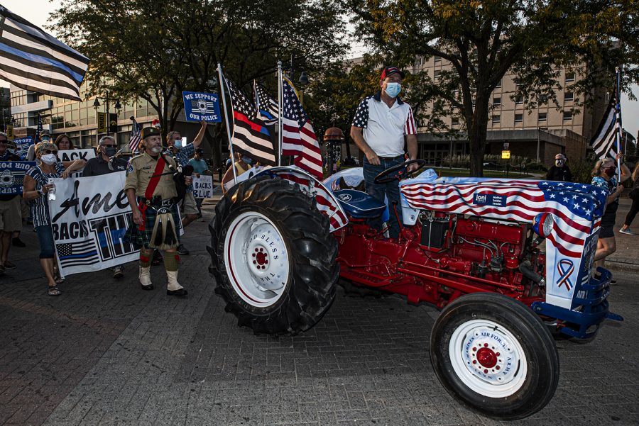Des Moines citizen Gary Leffler leads the Back the Blue march from his tractor on Friday, Sept. 25, 2020. Citizens marched through downtown Iowa City to show solidarity with the local police force.
