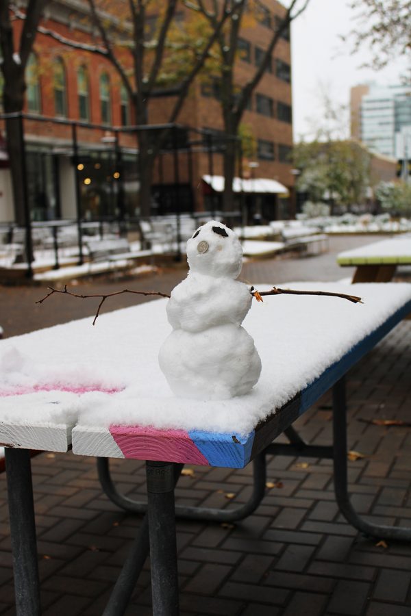 A lone snowman is seen in downtown Iowa City on Monday, Oct. 19, 2020. Unlike days prior, the outside seating was empty as temperatures were as low as 30 degrees.