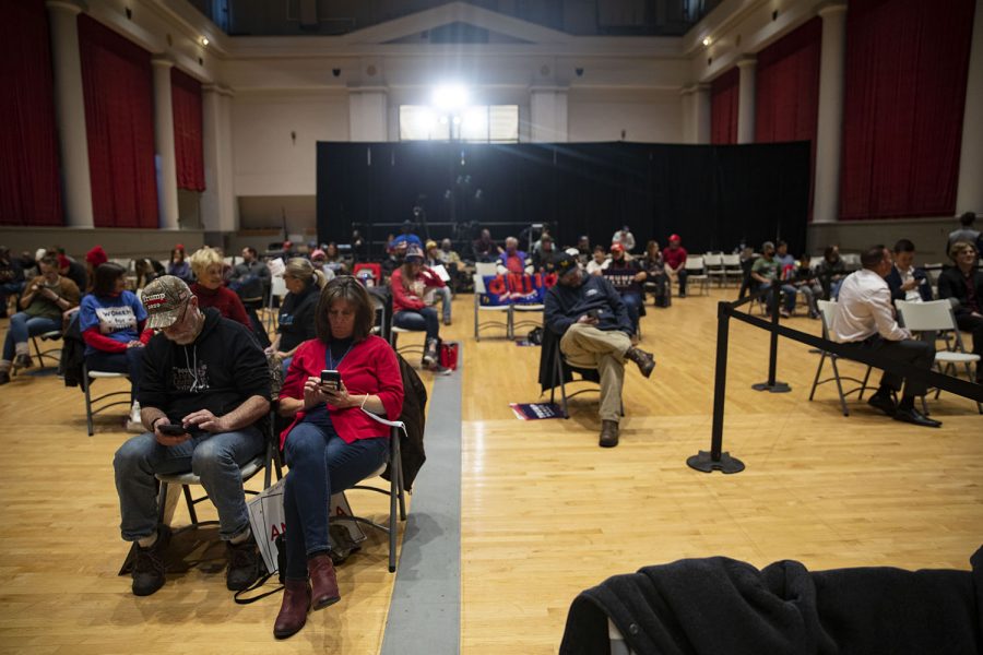Attendees wait for the Trump rally with Donald Trump Jr. to begin on Tuesday, Oct. 27, 2020 at the Veterans Memorial Coliseum in Cedar Rapids. The chairs were set up in pairs six feet away from each other, but as people filed in there was not enough room to spread out with over 200 people in attendance.
