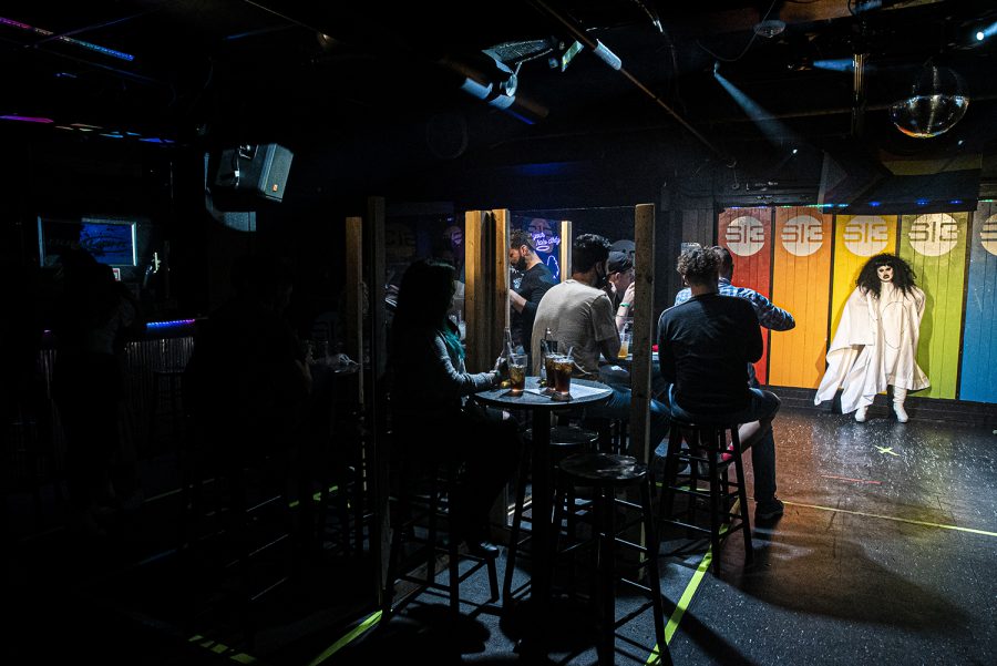 Studio 13 Patrons enjoy a drag show with drag queen, Beep Beep in downtown Iowa City on Friday, Oct. 9, 2020. As of this weekend, the government mandated closing of bars has been lifted prompting an upswing of business as locals and students return.