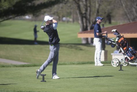Benton Weinberg takes a starting shot during a golf invitational at Finkbine Golf Course on Saturday, April 20, 2019. Iowa came in first with a score of 593 against 12 other teams. 
