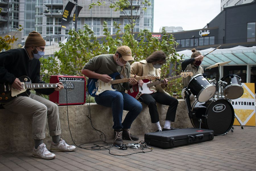 The local band known as Ped Mall play outside of Daydrink coffee shop in downtown Iowa City on Saturday, October 17, 2020.