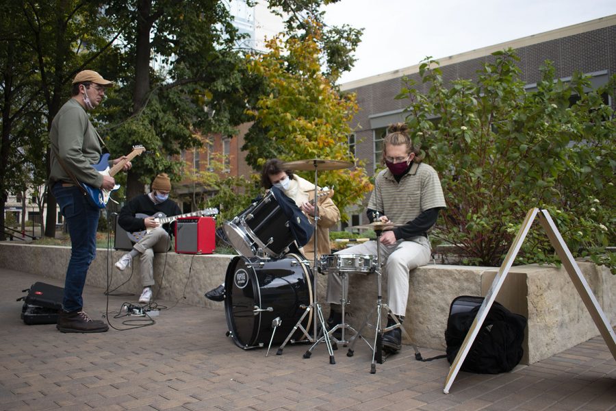The local band known as Ped Mall play outside of Daydrink coffee shop in downtown Iowa City on Saturday, October 17, 2020. 