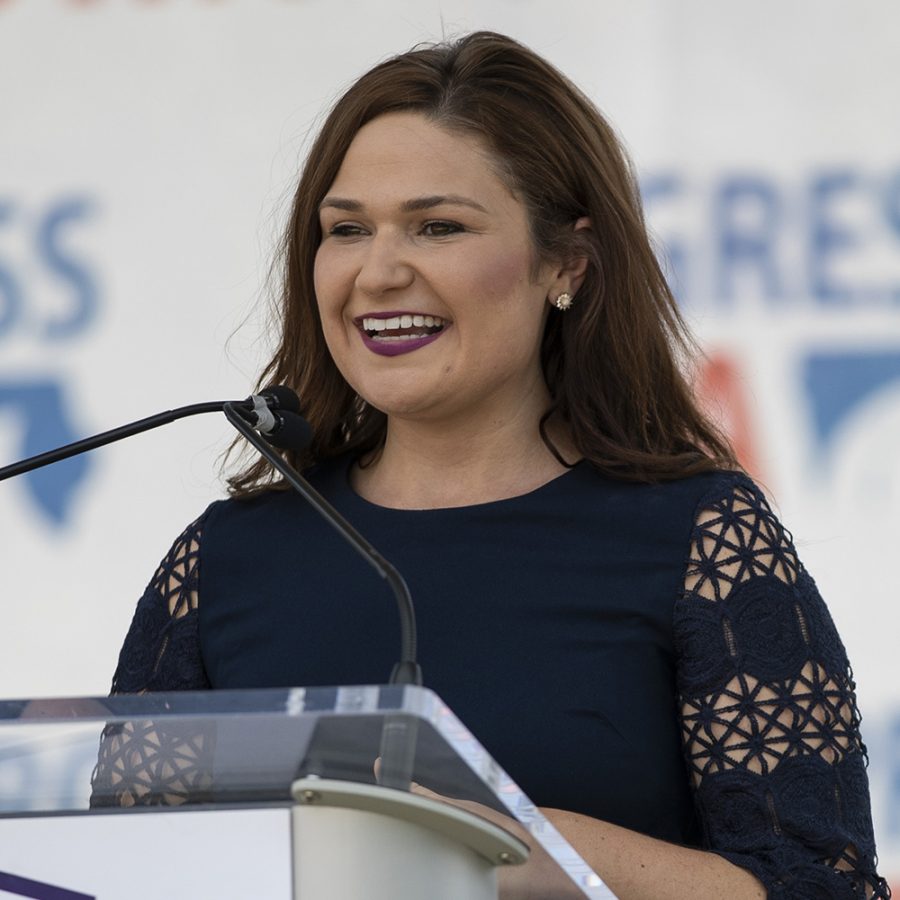 Congresswoman Abby Finkenauer addresses the audience during Progress Iowa Corn Feed at The Newbo City Market in Cedar Rapids on July 14, 2019. 11 candidates came to speak with supporters and give speeches.