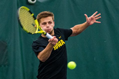 Iowas Will Davies hits a forehand during a mens tennis match between Iowa and Texas Tech at the HTRC on Thursday, Jan. 16, 2020. The Red Raiders defeated the Hawkeyes, 4-3.