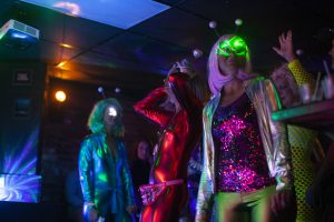 Attendees dance in alien costumes during Undercover Organism’s set at Yacht Club on Saturday, Oct. 26, 2019. Many members of the crowd sported Halloween costumes for the occasion.