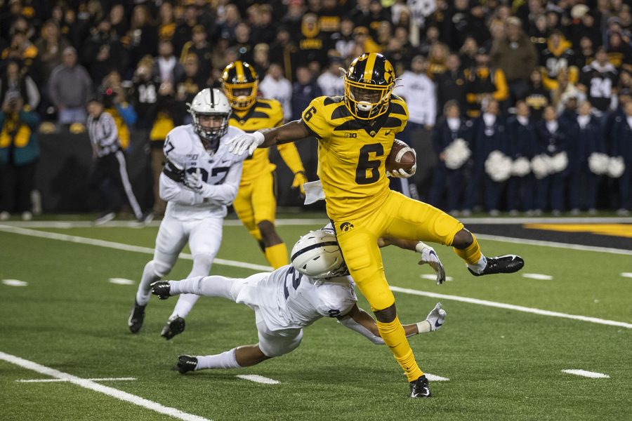 Iowa WR Ihmir Smith-Marsette jumps a defender during the Iowa football vs. Penn State game in Kinnick Stadium on Saturday, Oct. 12, 2019. The Nittany Lions defeated the Hawkeyes 17-12.