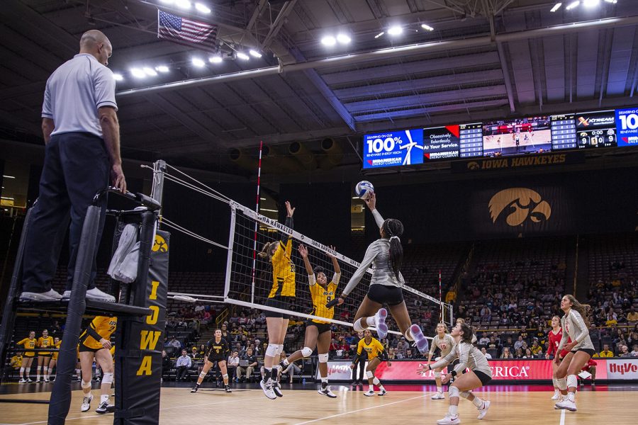 Ohio outside hitter Jenaisya Moore hits the ball to the Iowa side during a volleyball match between the University of Iowa and Ohio State University at Carver Hawkeye Arena on Friday, Novermber 29, 2019. The Buckeyes defeated the Hawkeyes 3-1. (Ryan Adams/The Daily Iowan)