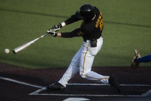 Iowa outfielder Ben Norman swings on a pitch during a baseball game between the Iowa Hawkeyes and the Kansas Jayhawks on Tuesday, March 10, at Duane Banks Field. The Hawkeyes defeated the Jayhawks, 8-0.