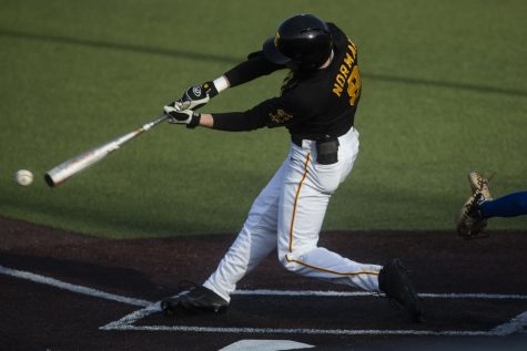 Iowa outfielder Ben Norman swings on a pitch during a baseball game between the Iowa Hawkeyes and the Kansas Jayhawks on Tuesday, March 10, at Duane Banks Field. The Hawkeyes defeated the Jayhawks, 8-0.