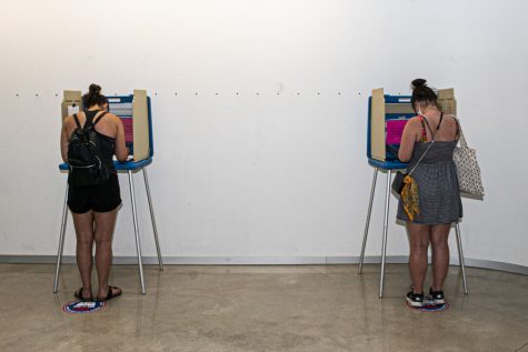 A pair of Johnson County citizens are seen anonymously voting in the The University of Iowa Visual Arts building on Tuesday, June 2, 2020. Counties all across Iowa along with eight other states are participating in the 2020 primary elections. 