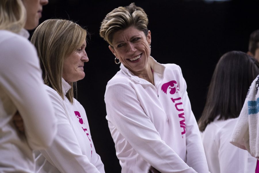 Iowa Associate Head Coach Jan Jensen chats with Iowa Special Assistant to the Head Coach Jenni Fitzgerald during a women’s basketball between Iowa and Wisconsin at Carver-Hawkeye Arena on Sunday, Feb. 16, 2020. The Hawkeyes defeated the Badgers 97-71.