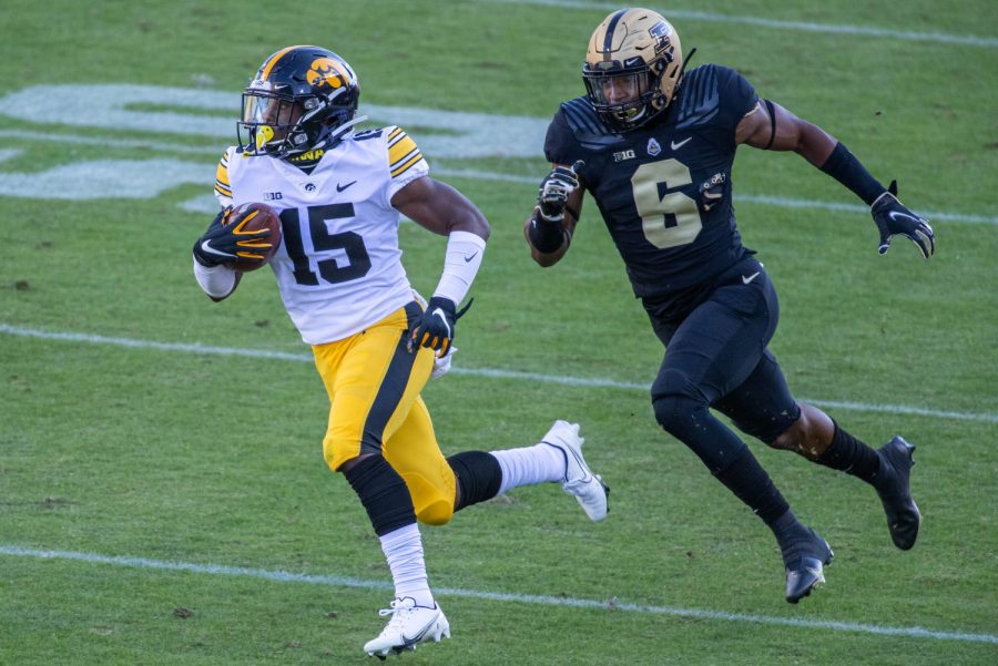 Iowa Hawkeyes running back Tyler Goodson (15) runs the ball while Purdue Boilermakers safety Jalen Graham (6) defends in the first quarter on Saturday, Oct. 24, 2020 at Ross-Ade Stadium. in West Lafayette, Indiana.