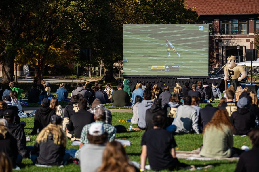 Purdue students sit on the Memorial Mall on Purdues campus during a student watch party for football game between Iowa and Purdue in West Lafayette, IN on Saturday, Oct. 24, 2020.