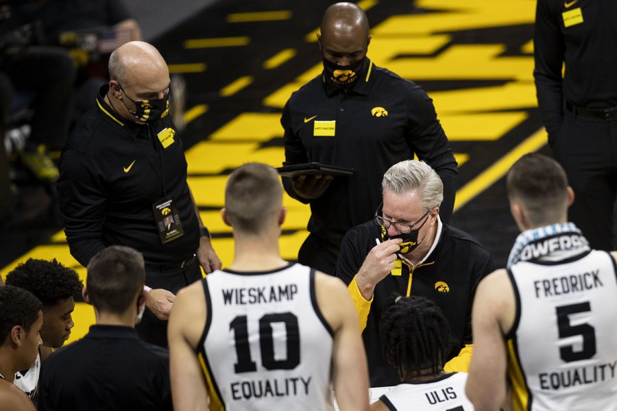 Iowa Head Coach Fran McCaffery adjusts his mask during a timeout during the first Iowa men’s basketball game of the season against the North Carolina Central Eagles at Carver-Hawkeye Arena on Wednesday, Nov. 25, 2020. The Hawkeyes defeated the Eagles 97-67. 