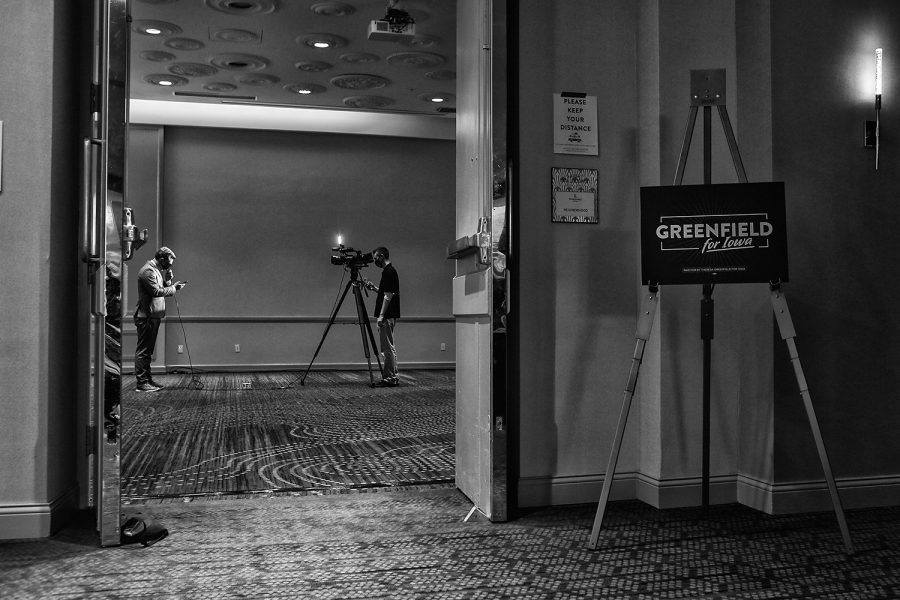 A news anchor practices for an upcoming broadcast during a watch party for Theresa Greenfield on Tuesday, Nov. 3, 2020 at the Renaissance Hotel in Des Moines. With the event closed to the public because of public health concerns for the pandemic, about 20 members of the media wait for the election results and Theresa Greenfield to arrive. 