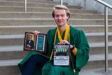 University of Iowa freshman Julian Wemmie poses for a portrait in front of his high school, Iowa City West. Wemmie was involved in numerous extracurricular activities throughout his time at West. 