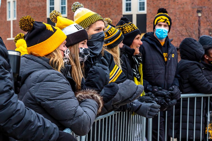 Hawkeye fans gather outside of Kinnick Stadium and cheer for the Iowa football team as they head into the stadium before the game against Nebraska on Friday, Nov. 27, 2020.