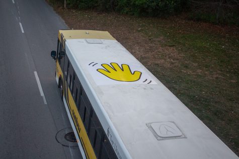 A University of Iowa Cambus, driving on South Riverside Drive on Nov. 18, has a wave decal on top of the bus to wave to kids when it drives by Stead Family’s Children Hospital.