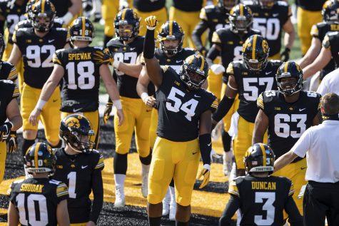 Iowa Defensive Tackle Daviyon Nixon raises his fist as the Hawkeyes take to their home field for the first time in the season during the Iowa v Northwestern football game at Kinnick Stadium on Saturday, Oct. 31, 2020.  The Wildcats defeated the Hawkeyes 21-20. 