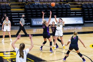 Iowa’s McKenna Warnnock passes the ball during the Iowa Hawkeyes Women’s Basketball season opener against Northern Iowa on Nov. 25, 2020. The Hawkeyes defeated Northern Iowa 96-81.