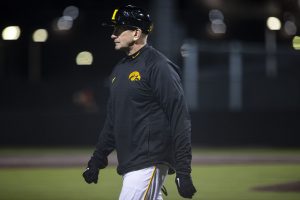 Iowa head coach Rick Heller watches the game from third base during a baseball game between Iowa and Grand View on March 3, 2020. The Hawkeyes defeated the Vikings 15-2. 