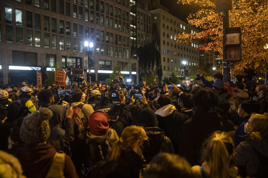 Protesters clash with police during protests outside of the White House on Black Lives Matter Plaza on Tuesday, Nov. 3, 2020. Protests began to get violent as police handcuffed a man. Protesters gathered and the police threw a smoke bomb. Only a few blocks away, President Trump holds a private party in the White House. 