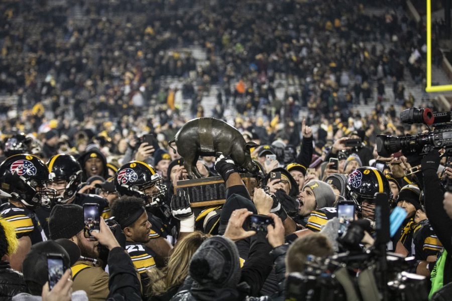 Iowa+football+players+carry+the+Floyd+of+Rosedale+trophy+off+the+field+after+a+football+game+between+Iowa+and+Minnesota+at+Kinnick+Stadium+on+Saturday%2C+November+16%2C+2019.+The+Hawkeyes+defeated+the+Gophers%2C+23-19.