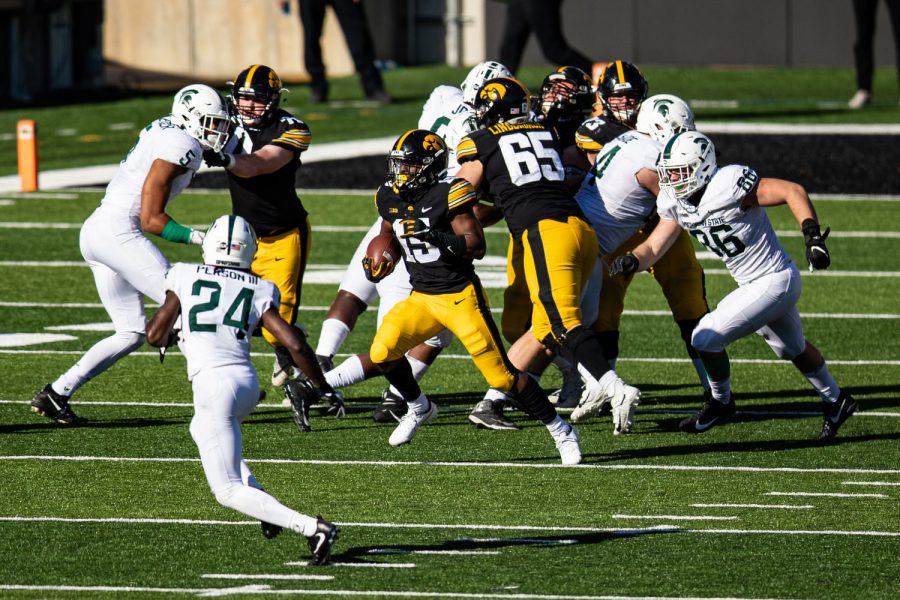 Iowa running back Tyler Goodson carries the ball during a football game between Iowa and Michigan State in Kinnick Stadium on Saturday, Nov. 7, 2020. The Hawkeyes dominated the Spartans, 49-7. (Shivansh Ahuja/The Daily Iowan)