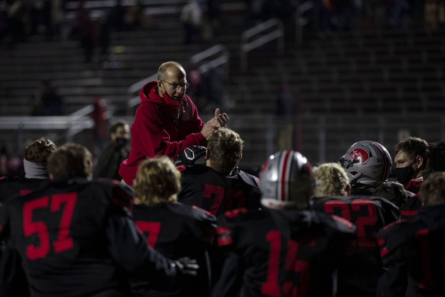 City High head coach Dan Sabers congratulates the team after the first varsity football playoff game between City High and Ottumwa on Friday, Oct. 16, 2020 at Frank Bates Field. The Little Hawks defeated the Bulldogs with a score 41-16. At the beginning of the game, announcers told the crowd to wear masks and practice social distancing.