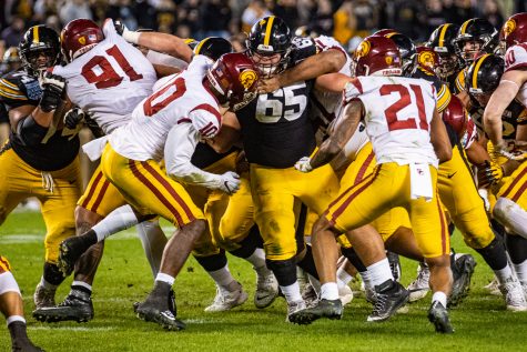 Iowa center Tyler Linderbaum throws a block during the 2019 SDCCU Holiday Bowl between Iowa and USC in San Diego on Friday, Dec. 27, 2019. The Hawkeyes defeated the Trojans, 49-24.