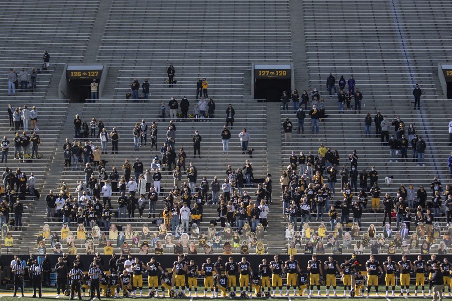 Players kneel and stand for the national anthem before the Iowa v Northwestern football game at Kinnick Stadium on Saturday, Oct. 31, 2020. Head Coach Kirk Ferentz did not kneel for the anthem.The Wildcats defeated the Hawkeyes 21-20. 