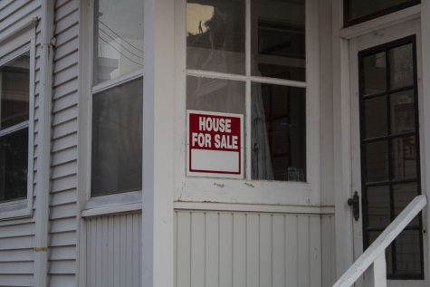 A For Sale sign is seen on Tuesday, Nov. 17,  2020. With families wanting larger homes to inhabit while being stuck at home due to COVID-19, real estate companies are doing notably well.